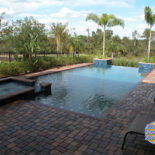 Infinity Pool with Pavers and Spa